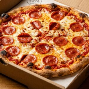 # 1 - 14â€ Pizza  â€¢ 1 topping + 12 Wings  â€¢ One 2LT Soda