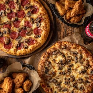 # 11 - 2 x 16â€ Pizza â€¢ 2 toppings + 20 Wings  â€¢ Two 2LT Soda