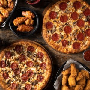# 7 - 16â€ Pizza â€¢ 2 top. + 12 Wings â€¢ 8 Fingers + One 2LT Soda