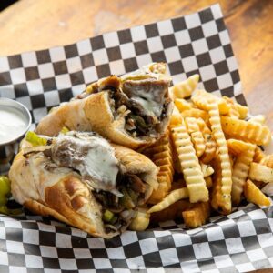 Philly cheese steak sandwich with fries