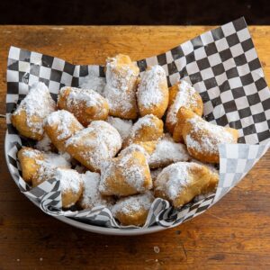 Zeppolis dusted with powdered sugar
